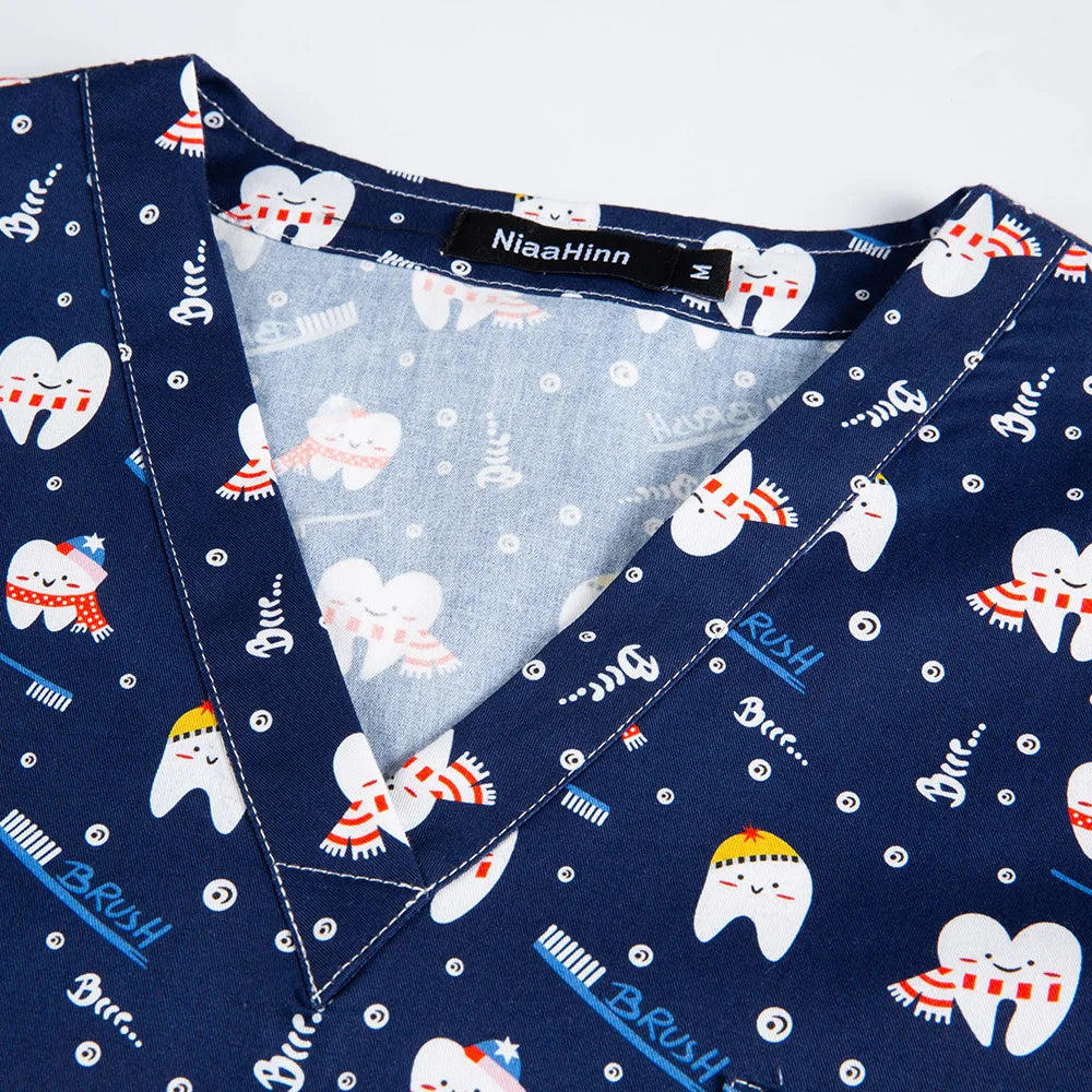 Navy cotton nurse scrubs featuring playful tooth graphics and bright colors, perfect for medical professionals.