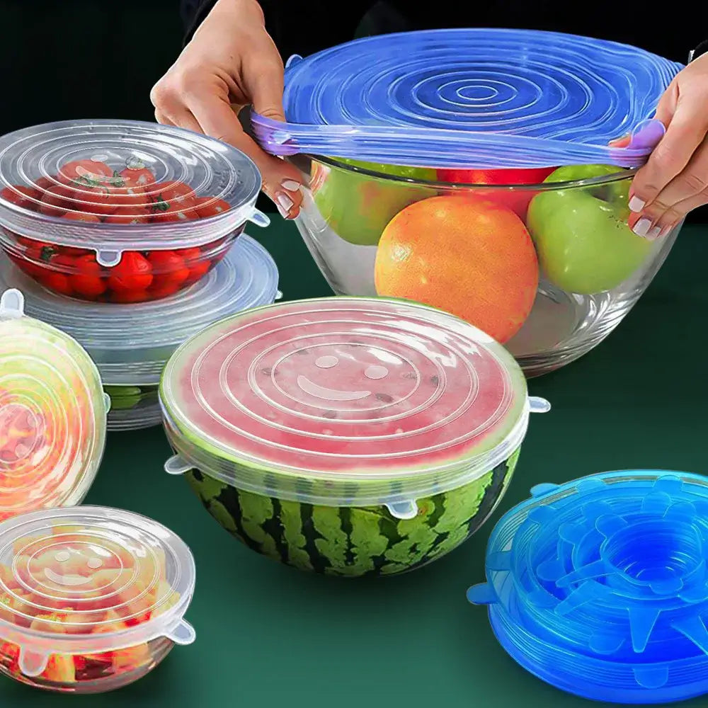 6 Pcs Silicone Stretch Lids in use on various food containers like bowls of fruits and vegetables, ideal for kitchens and microwaves.