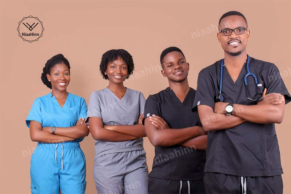 Group of four healthcare professionals wearing scrubs, showcasing breathable medical uniforms in diverse styles and colors.