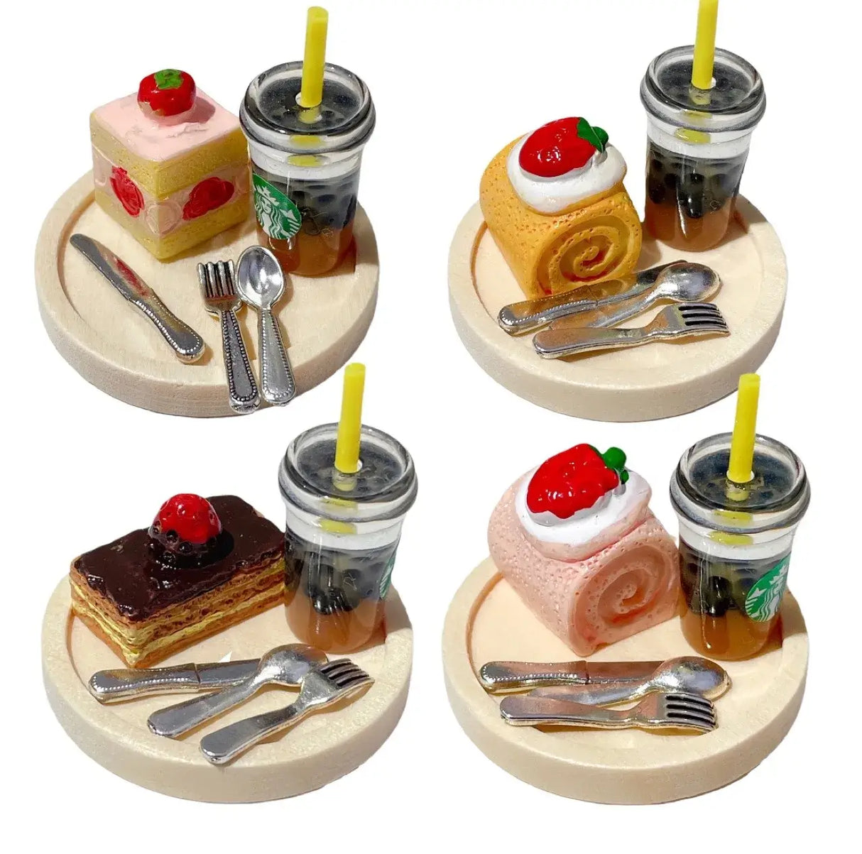 Miniature dessert props with cakes and drinks on wooden plates for photography or display.