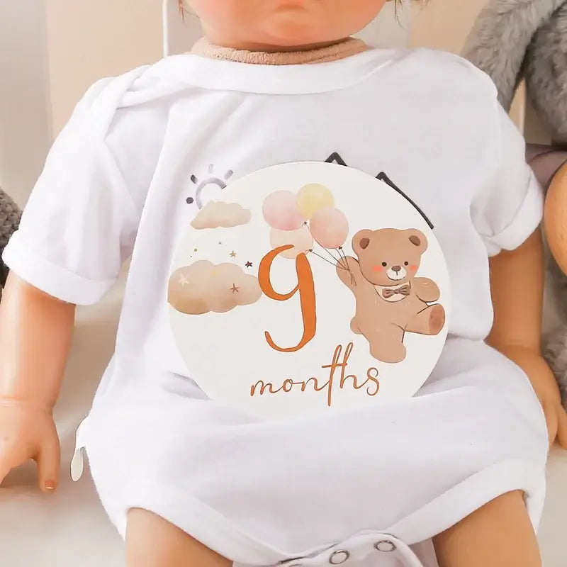9 months milestone card featuring a bear holding balloons, perfect for baby photo shoots and tracking growth.