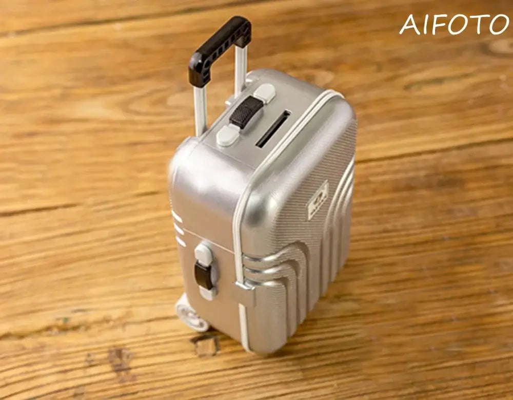 BABI Boy Clothes Creative Mini Suitcase for infants 0-6m, made of cotton, silver design with wheels and handle.