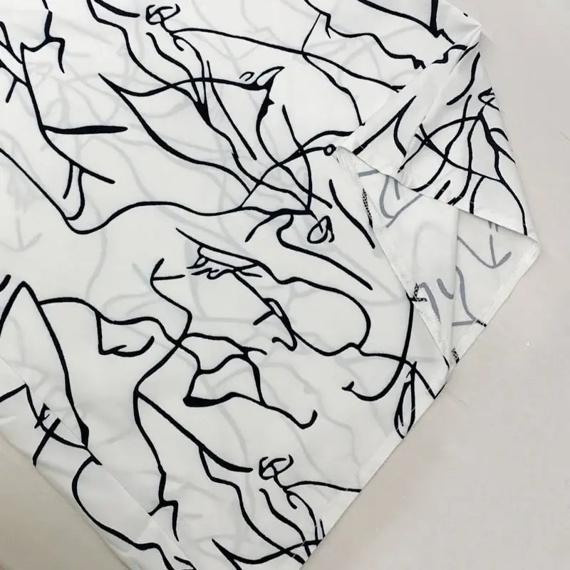 جمبسوت نسائي واسع الساق بطبعة فنية