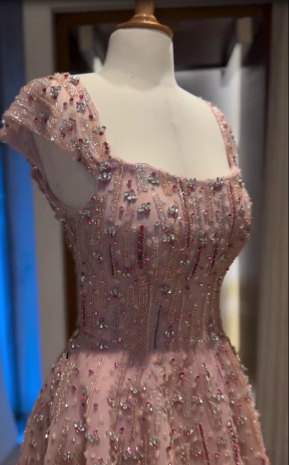 Fully crystal embellished mermaid wedding gown with a square neckline and glitter cape strap details.