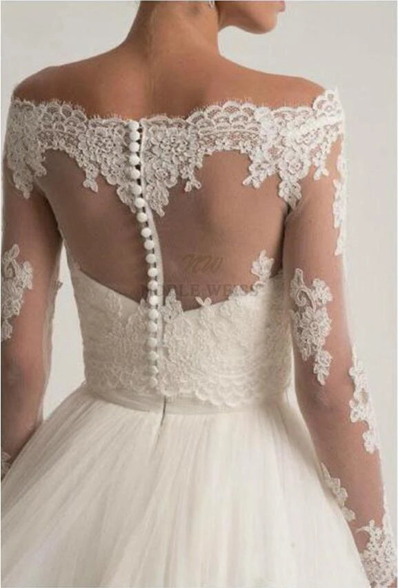 Elegant lace off shoulder bridal jacket with long sleeves, featuring intricate appliqué design and button details on the back.