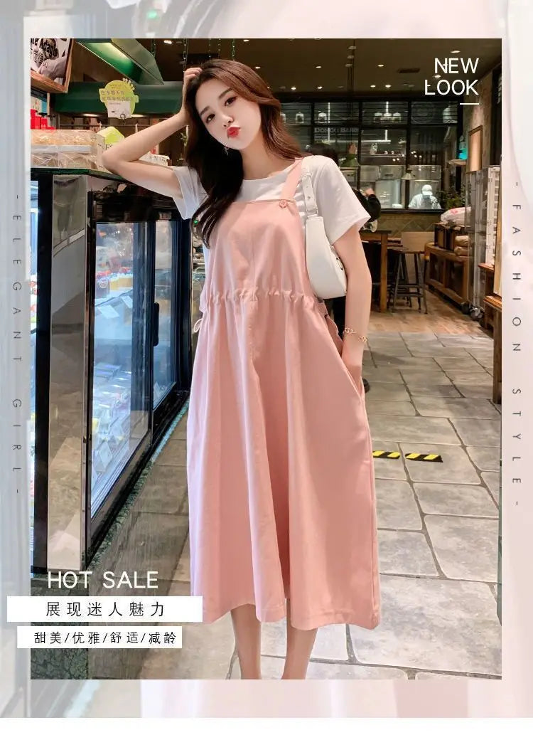 Korean loose fit maternity dress in pink, perfect for holiday photography, featuring a relaxed silhouette and mid-calf length.