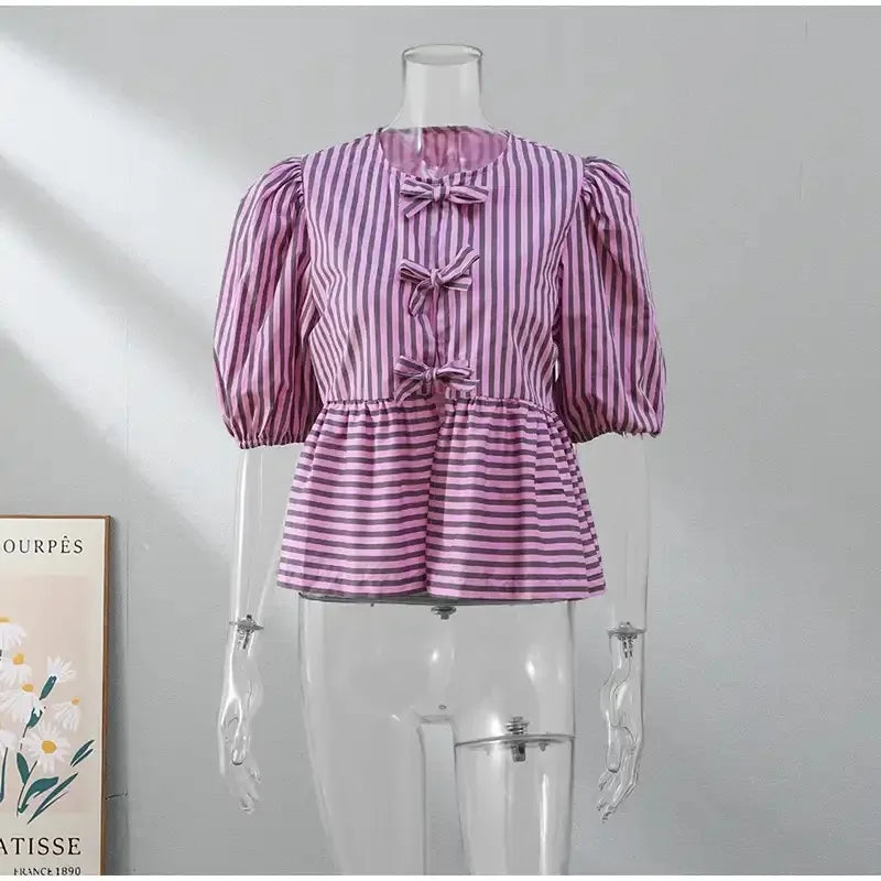 BowChic Stripe Lace-Up Blouse for women, featuring puff sleeves and a stylish striped design in pink.