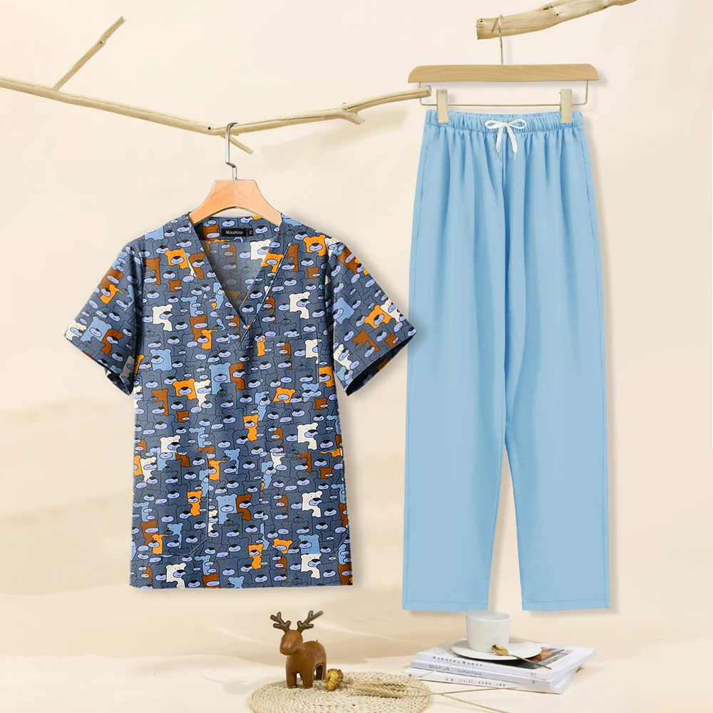 Cartoon print dental scrubs set for pet grooming, featuring a V-neck top and breathable pants, ideal for women.