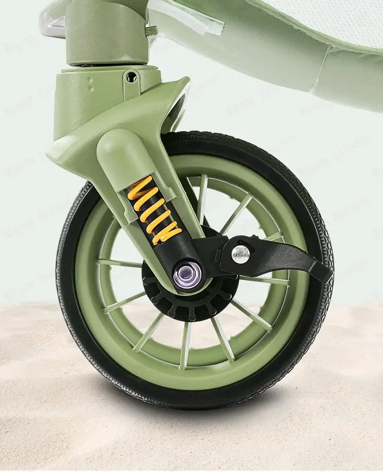 Close-up of the EVA foaming wheel on a bi-directional high landscape baby stroller in green.