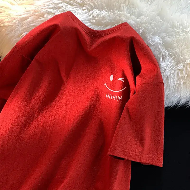 تي شيرت نسائي فضفاض غير رسمي بمقاس كبير ووجه مبتسم