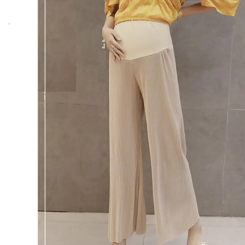 Breathable adjustable waist maternity pants in natural color, pleated design, summer wide leg style for comfort.