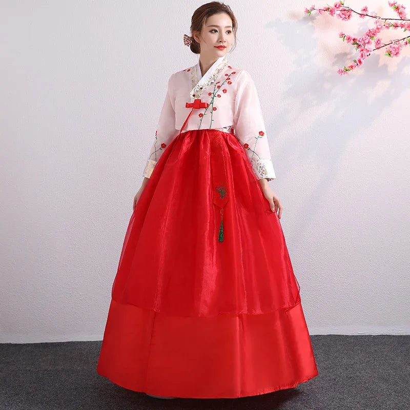Korean Palace Hanbok in red with floral details, perfect traditional dress for women, showcasing cultural elegance and style.