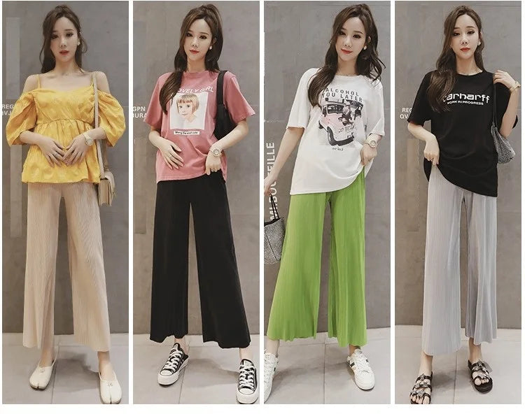Four stylish women in wide leg maternity pants showcasing different colors and tops, perfect for summer wear.