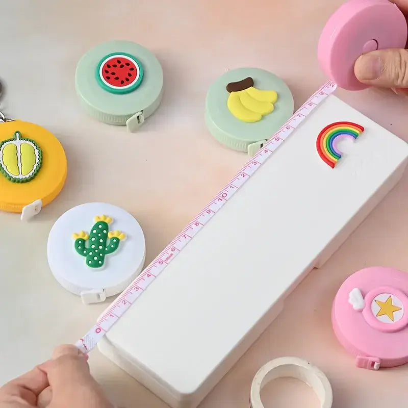Cute mini baby height ruler with colorful fruit-shaped markers and whimsical designs for fun measurements.