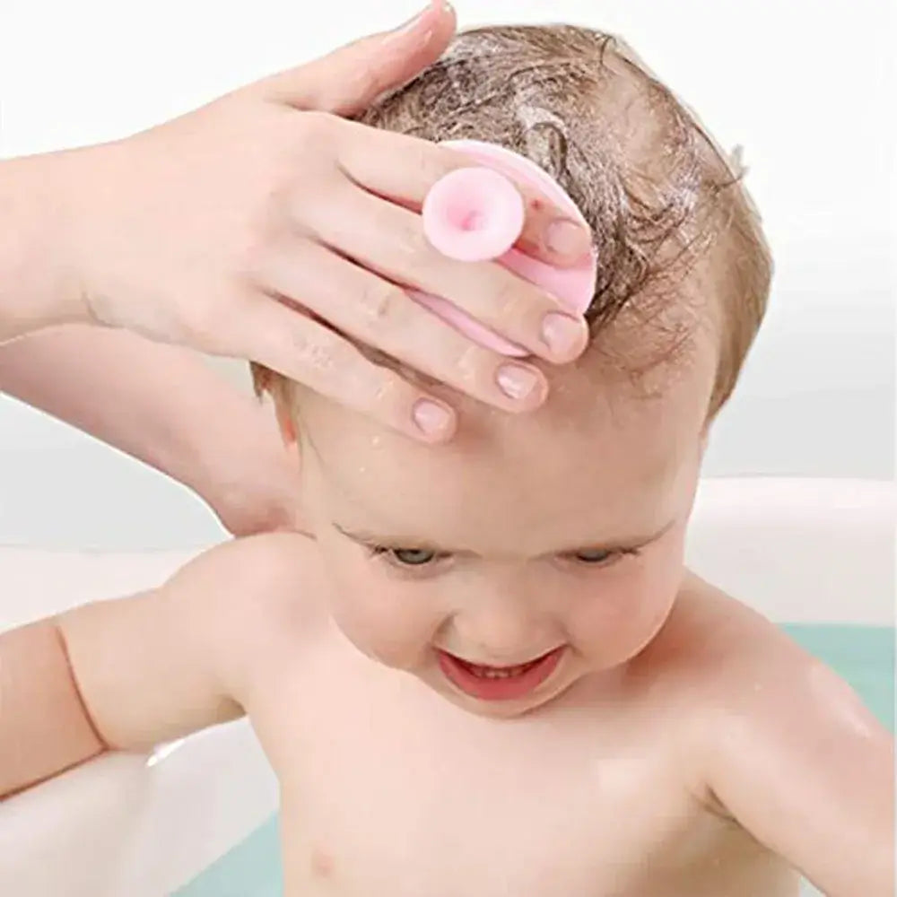 Baby using silicone bath brush during bath time, showcasing gentle hair cleaning and baby care.