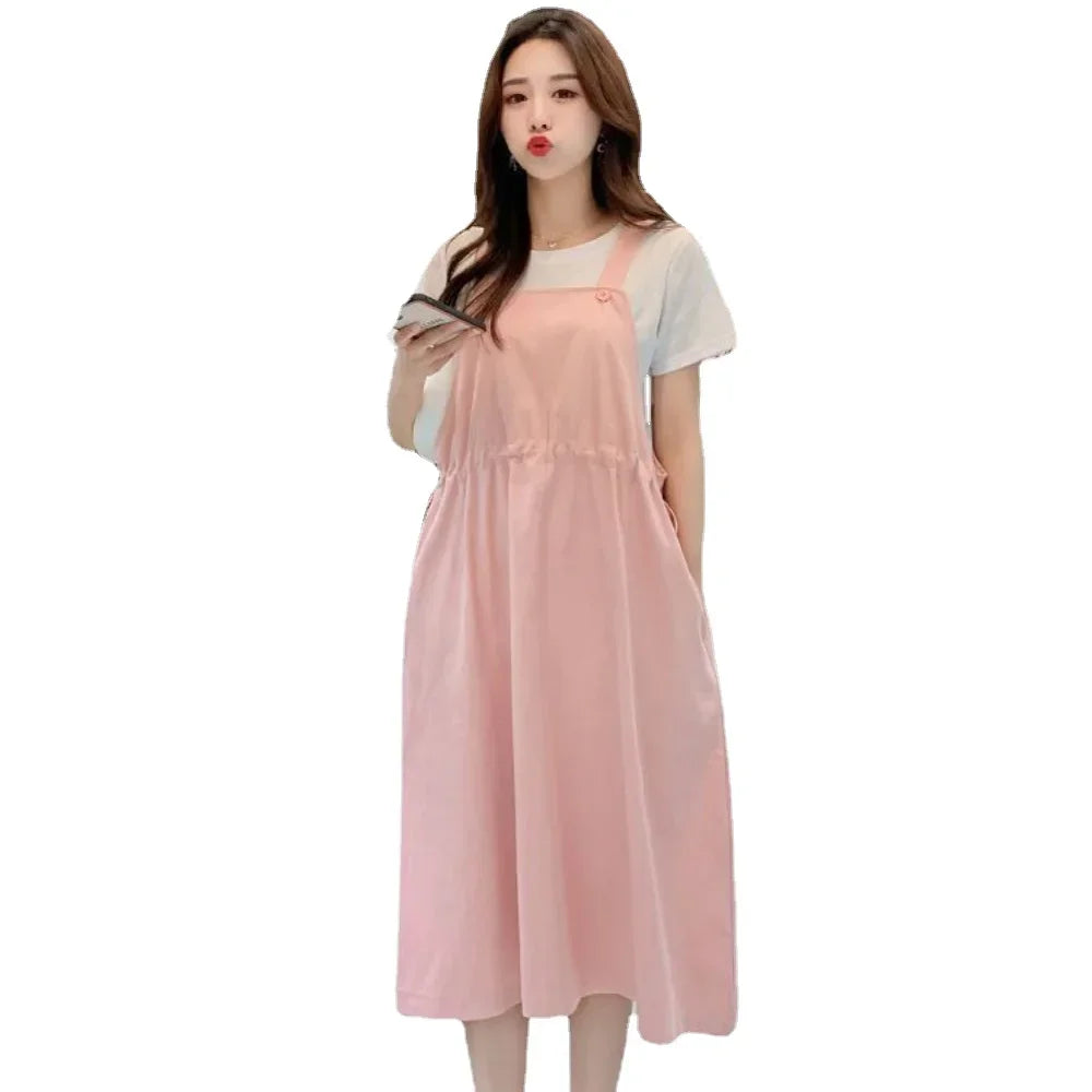 Korean loose fit maternity dress in soft pink, ideal for holiday photography and casual outings.