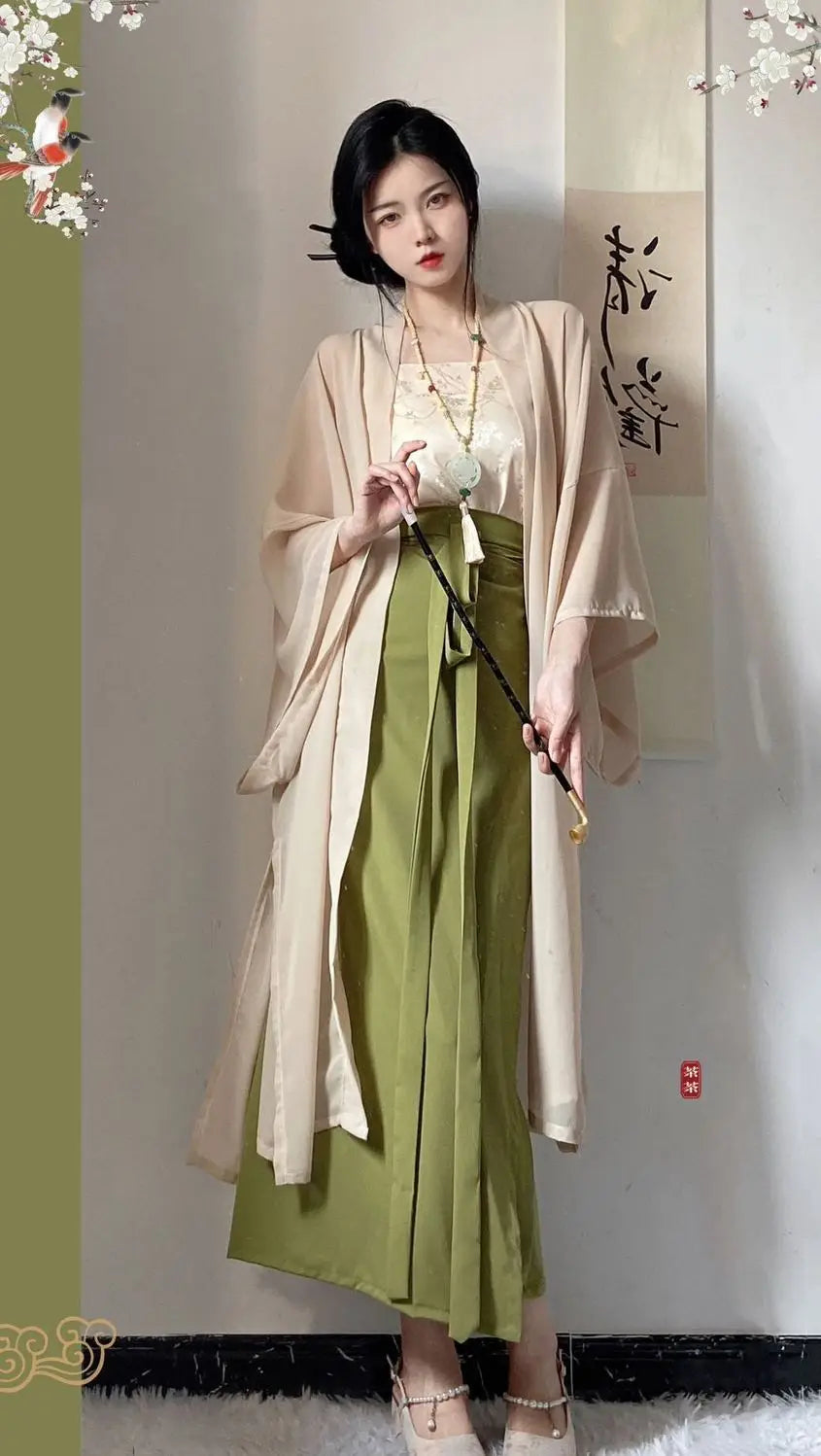 Elegant woman wearing a Princess Song Dynasty Hanfu 3-piece robe, featuring a flowing beige top and green skirt.