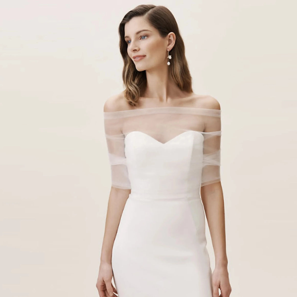 Model wearing VG73 sheer wedding jacket bolero over a strapless wedding dress, perfect for bridal occasions.