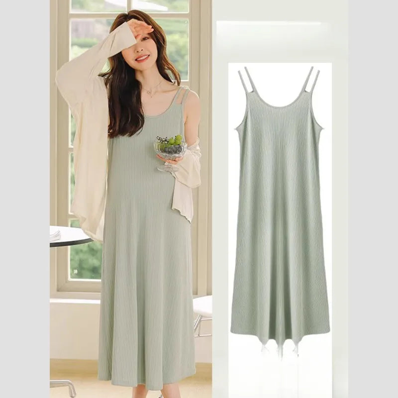 Sleeveless strap maternity dress in light green for summer, featuring a casual A-line silhouette and boat neck.