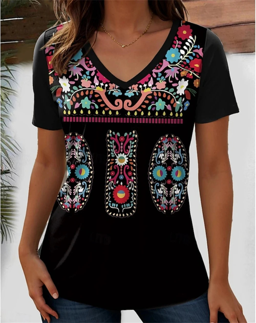 3D flower graphic V-neck tee for women, featuring vibrant floral patterns on a black background.