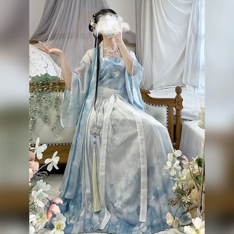 Vintage blue Hanfu cosplay dress 3-piece set worn by a model in a serene indoor setting with floral decor.