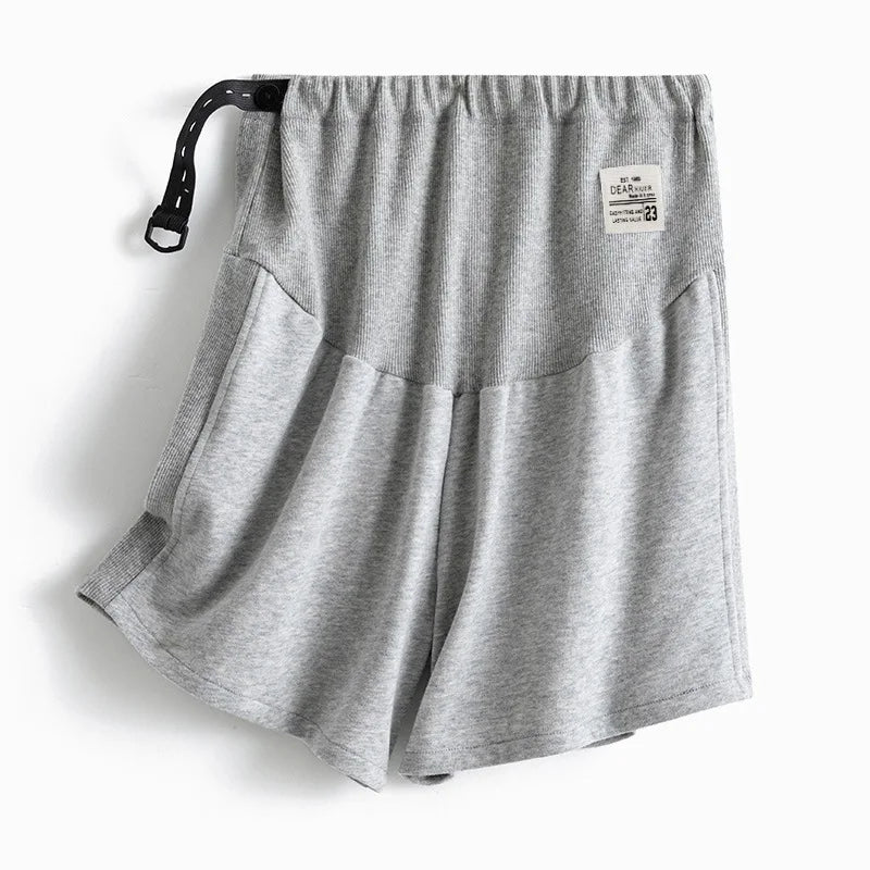 Plus size adjustable maternity shorts in grey, featuring a loose fit and comfortable elastic waistband.