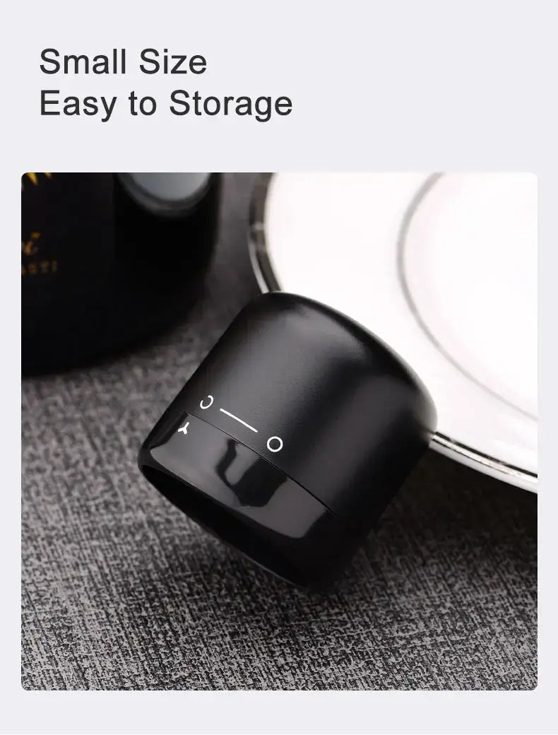Small black silicone wine bottle cap stopper for easy storage, ideal for preserving red wine.