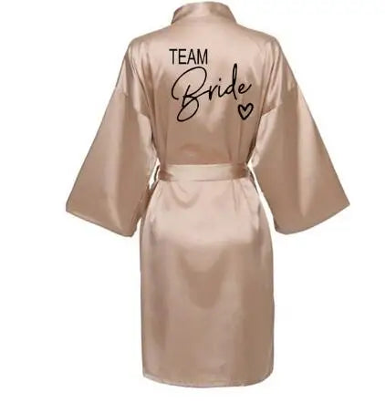 Team Bride kimono satin robe with stylish black lettering, perfect for bridal parties and celebrations.