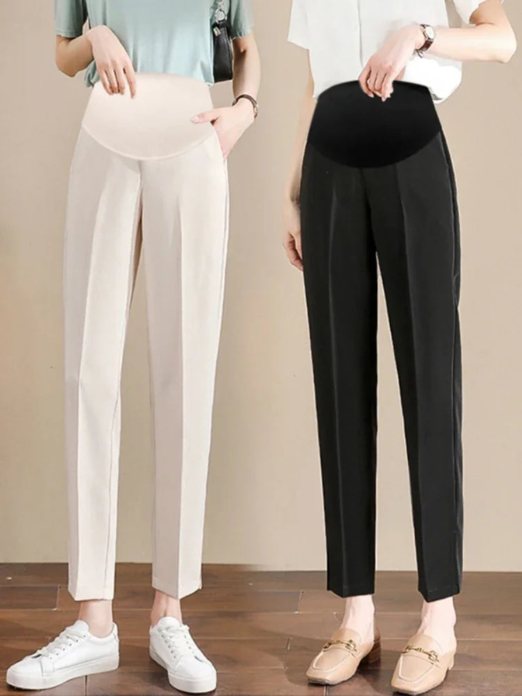 Formal black and beige maternity pants, designed for summer work wear, featuring a straight fit and pockets.