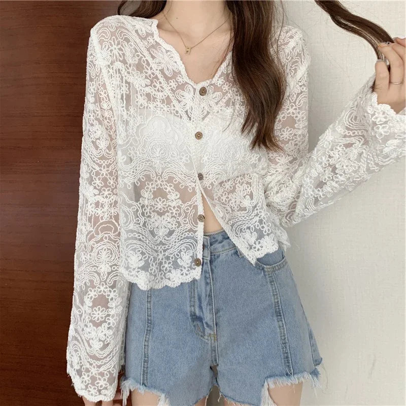 SheerCharm™ lace sun shirt for women, featuring a V-neck and long sleeves, perfect for summer fashion.
