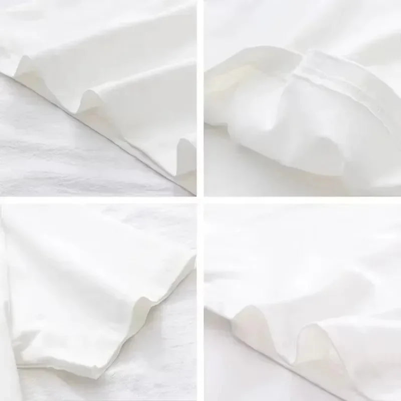 Close-up view of the soft, white fabric draping of a Vintage Floral V-Neck T-Shirt, showcasing its smooth texture and edges.