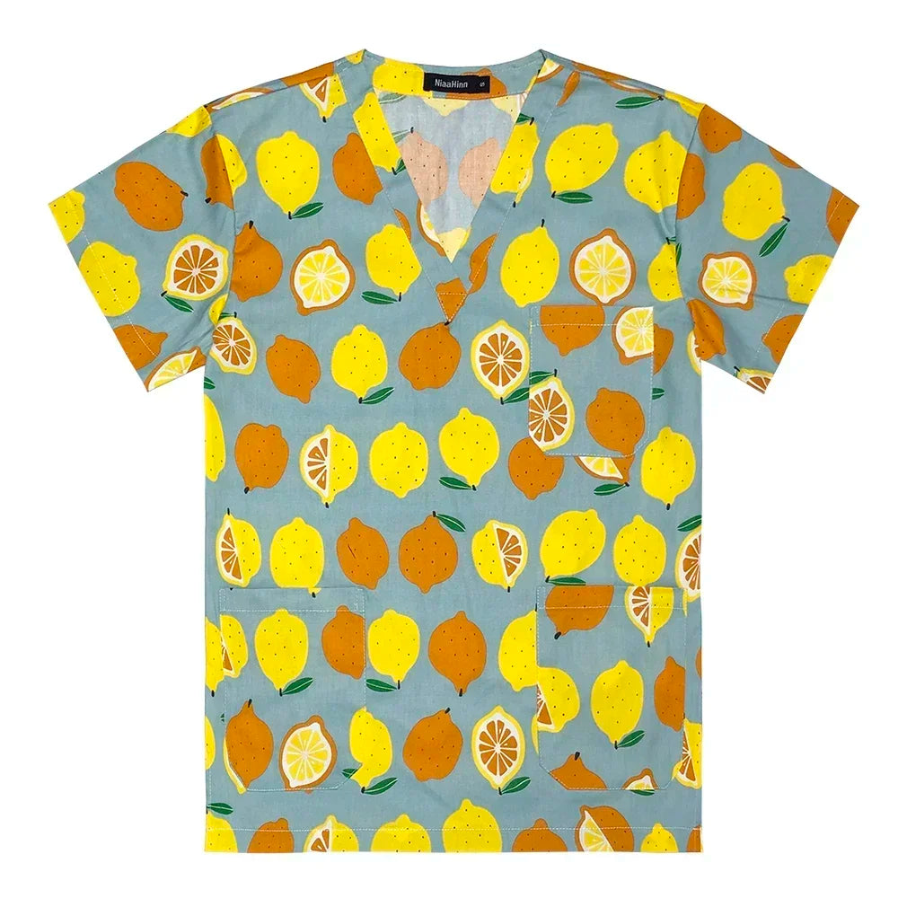 Women’s cotton scrubs featuring vibrant lemon and citrus fruit print, perfect for medical and beauty professionals.