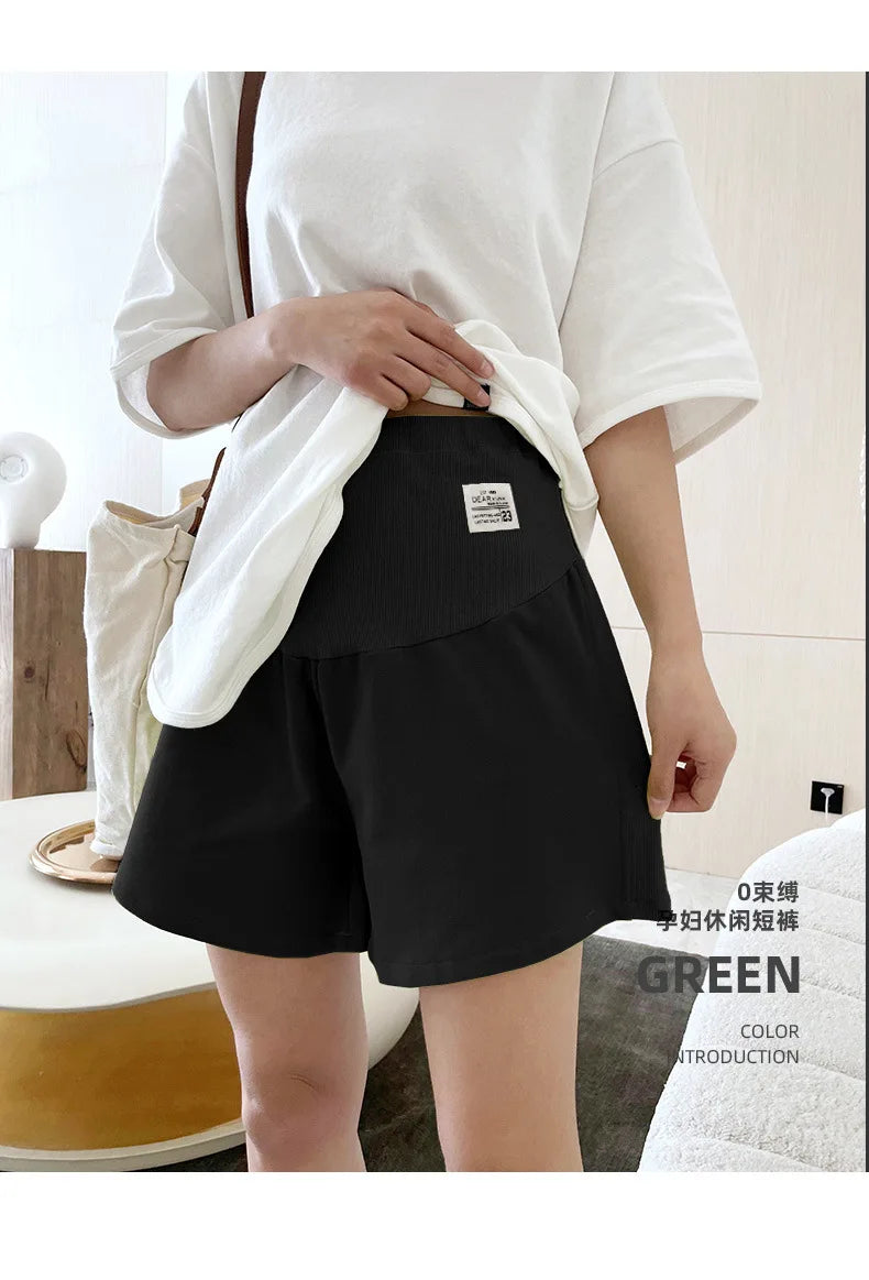 Plus size adjustable maternity shorts in black, perfect for summer, featuring a loose fit design for comfort.