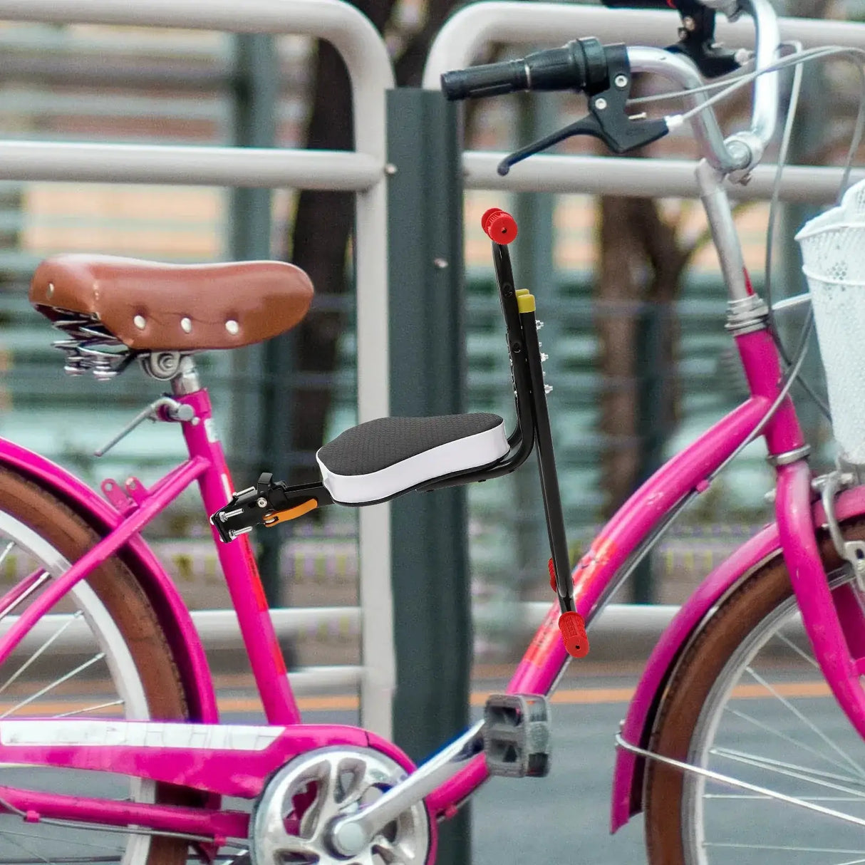 Kids electric bike saddle seat attached to a pink bicycle, showcasing a comfortable backrest and design for ages 12 and up.