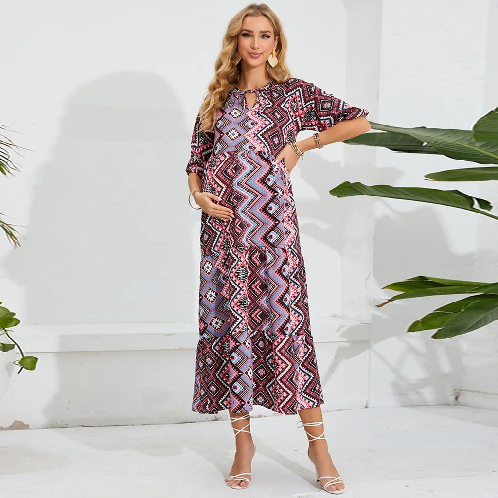 Elegant beach maternity dress with geometric pattern, perfect for summer photoshoots and stylish comfort for expectant mothers.