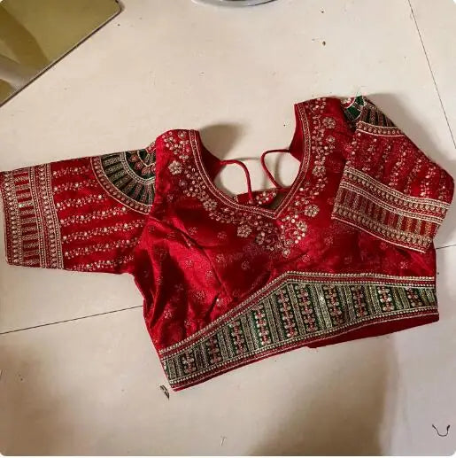 Red embroidered India sari top with intricate patterns, perfect for women's traditional ethnic wear.