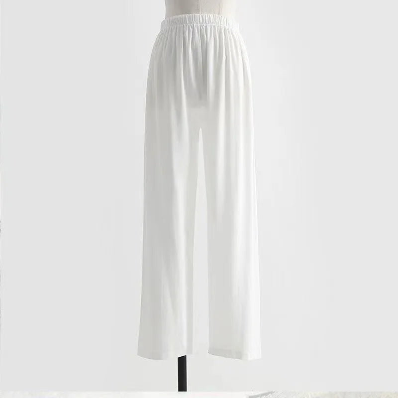 White elastic waist wide-leg pants for men and women, made from lightweight polyester material.