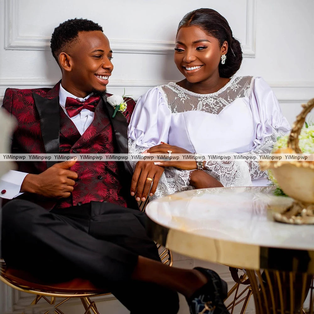 Couple enjoying a joyful moment together, showcasing elegant wedding attire and a stylish setting.