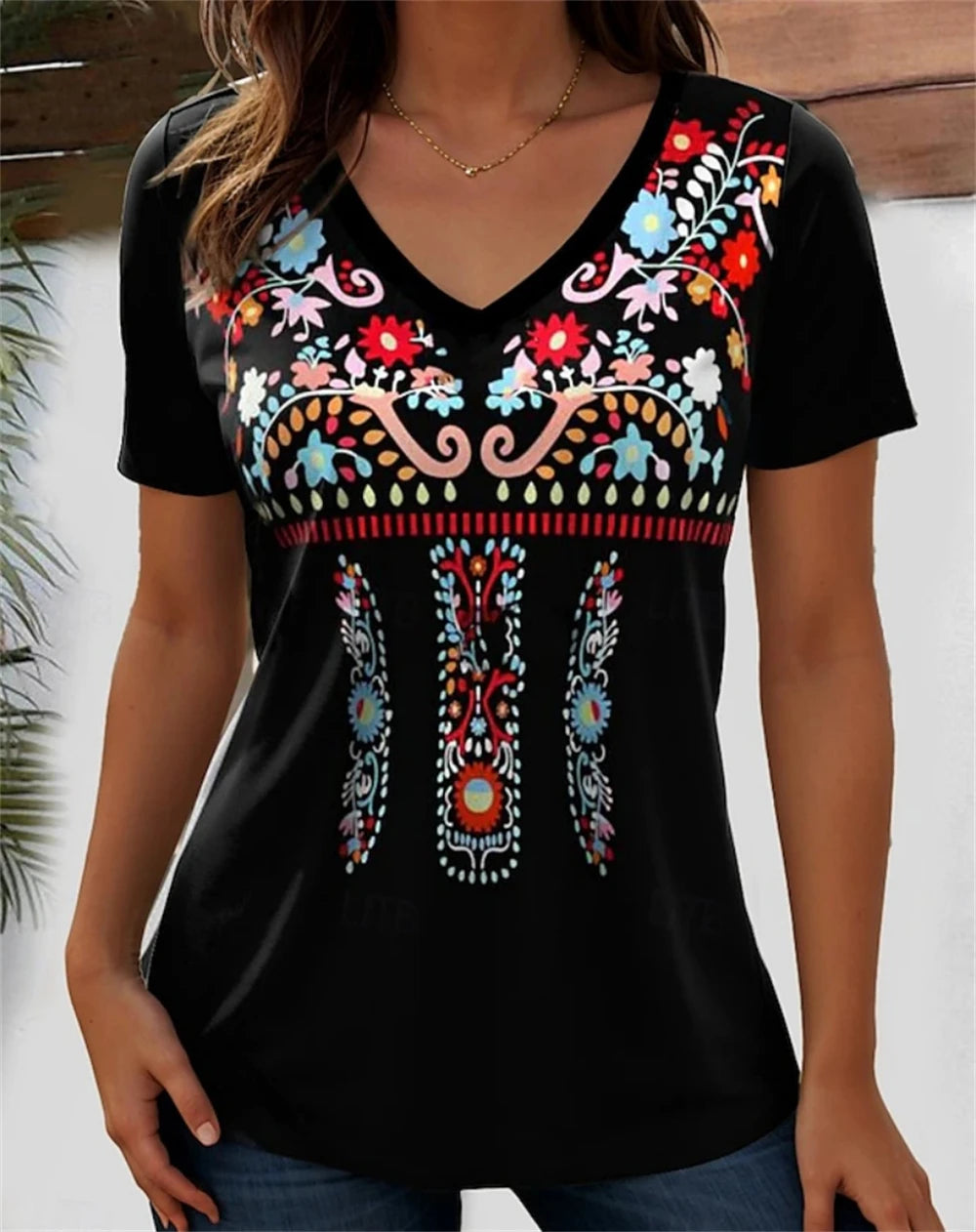 3D floral graphic V-neck tee for women with vibrant colorful embroidery on a black background.