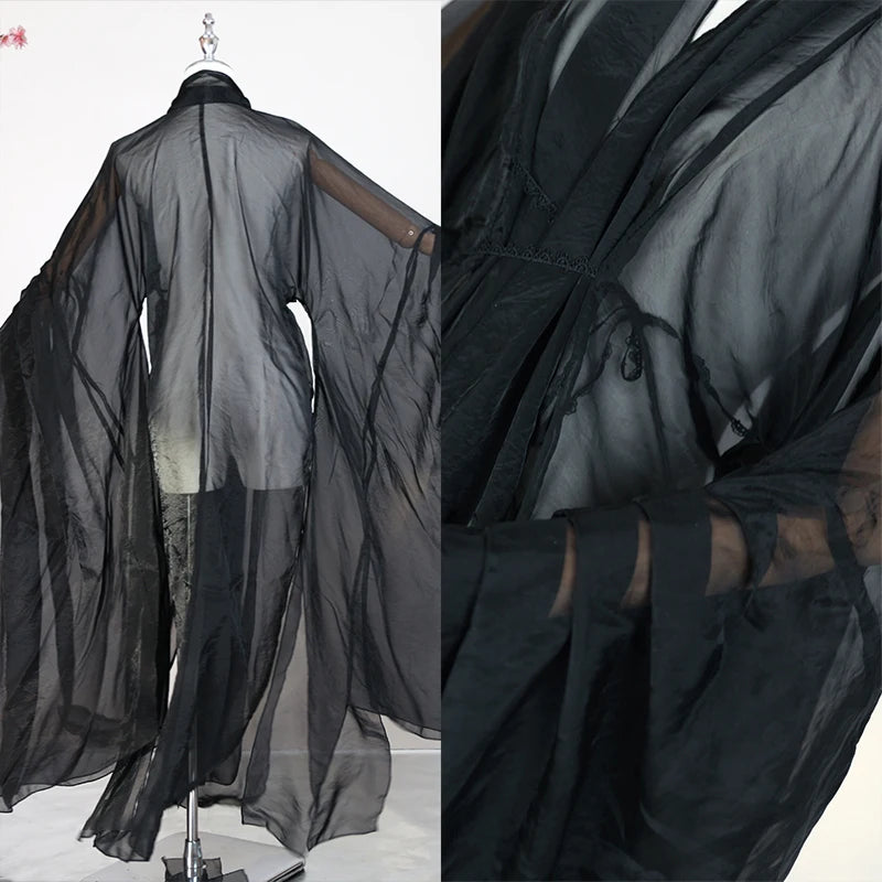 Elegant women’s classical Hanfu in sheer black fabric, featuring long sleeves, perfect for stage costumes and performances.