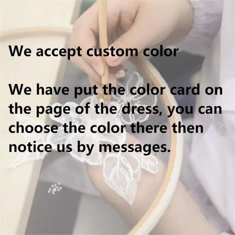 Custom color selection process for satin wedding dress, showcasing the color card and embroidery details.