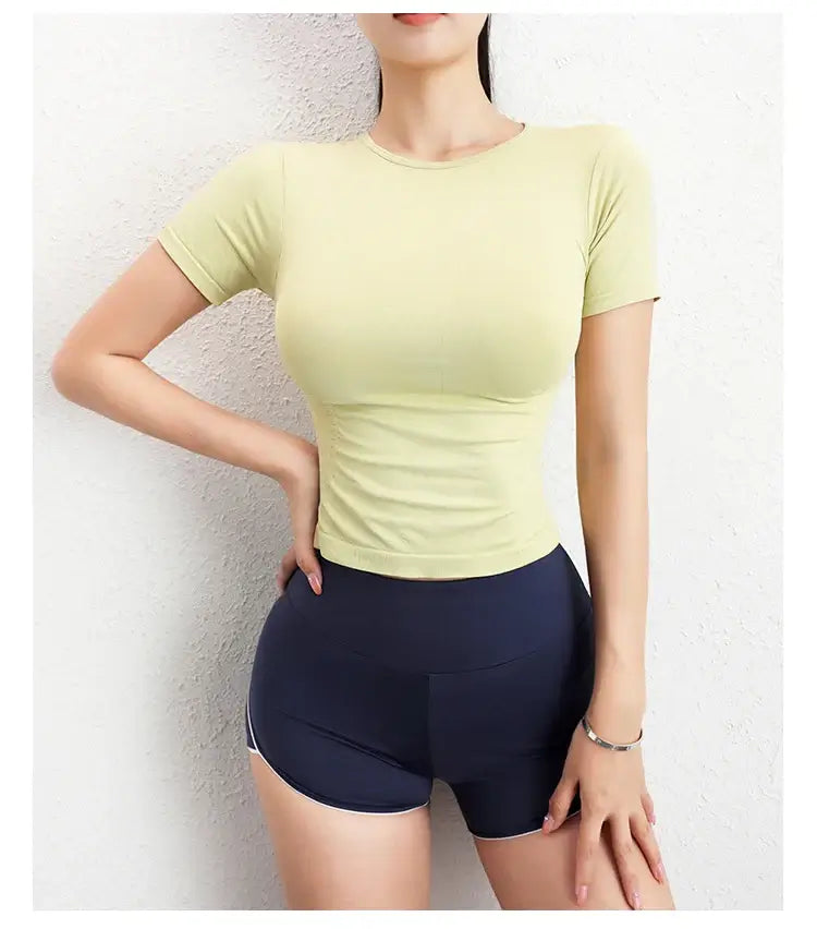 قميص رياضي نسائي ضاغط بأكمام قصيرة بدون درزات