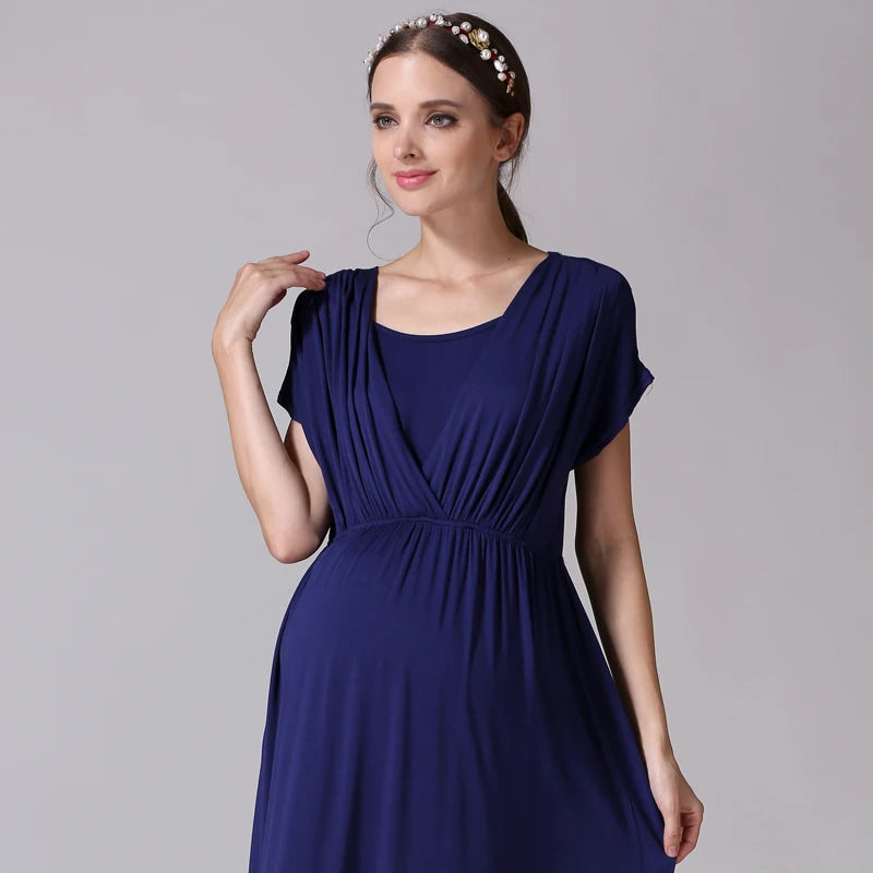 Model wearing a soft fabric nursing maternity dress in navy blue, featuring a comfortable design for postpartum use.