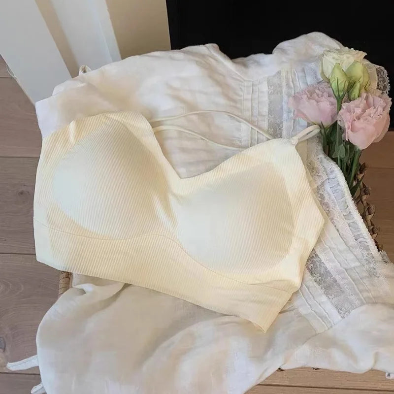 CrossForm™ padded backless tank top in soft yellow, featuring a sexy vest style and hollow out design.