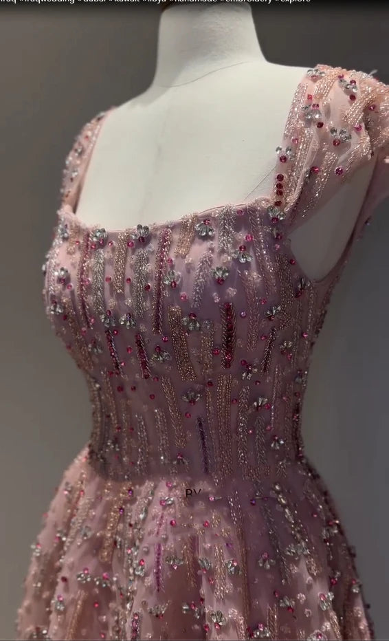 Elegant pink beaded crystal mermaid wedding gown with a square collar and sparkling embellishments.