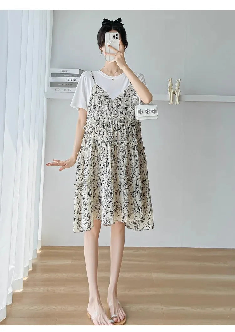 Elegant floral maternity dress in knee-length, featuring a boat neck and a cute silhouette, perfect for summer baby showers.