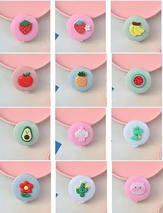 Colorful fruit and flower-themed buttons, featuring designs like strawberries, bananas, and a pig, arranged in a grid layout.