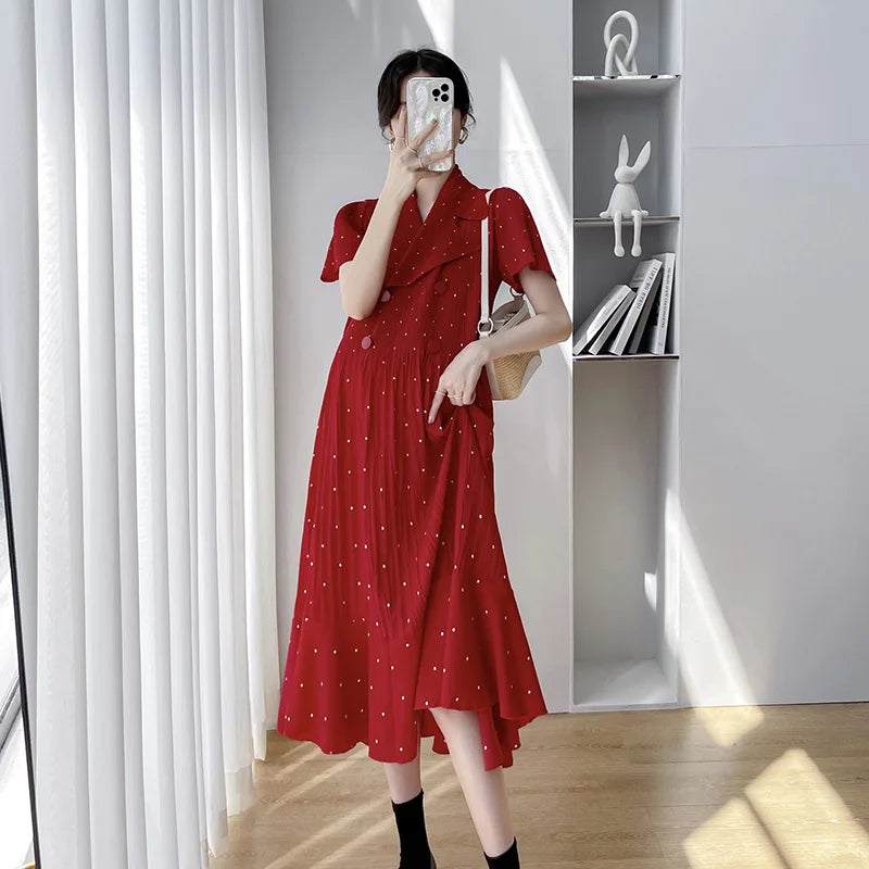 Polka dot Korean maternity dress in red, featuring short sleeves and a mid-calf length, perfect for summer wear.