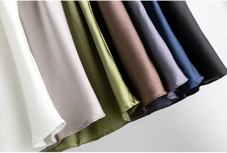 Variety of silk fabric colors showcasing the luxurious texture for summer camisole options.