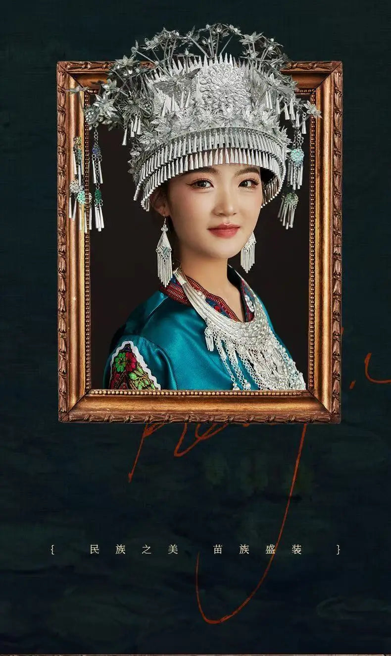 Portrait of a woman in traditional Miao embroidery suit with ornate headpiece, showcasing ethnic fashion and cultural heritage.